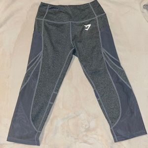 Gymshark grey capris with pockets and mesh, size small.